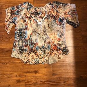 Sheer top looks great with a tank under it.